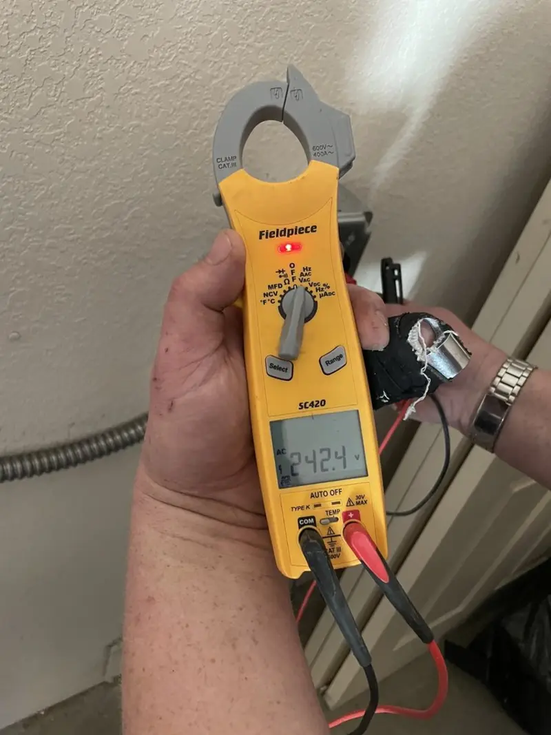 Voltage testing with clamp meter during Outlet Installation in Hubbard